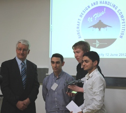 Photo - Winners receiving the Harrier Trophy from Chris Neal